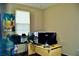 Bedroom with a computer desk and three monitors at 5705 Petrified Tree Ln, North Las Vegas, NV 89081
