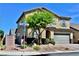 Beautiful two story home with a well manicured front yard and mature landscaping at 5705 Petrified Tree Ln, North Las Vegas, NV 89081