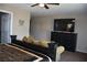Comfortable main bedroom with sitting area, dark wood furniture, and large television at 5705 Petrified Tree Ln, North Las Vegas, NV 89081