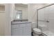 Bright bathroom featuring a glass shower enclosure, white vanity, and a neutral color palette at 6731 Violet Cascade Ave, Las Vegas, NV 89156