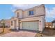 Attractive two-story home featuring a paved driveway, desert landscaping, and inviting curb appeal at 6737 Violet Cascade Ave, Las Vegas, NV 89156