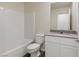 Bathroom with tub and shower combination, white vanity and fixtures at 6749 Violet Cascade Ave, Las Vegas, NV 89156