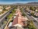 Overhead view of a neighborhood, highlighting the streets, roofs, and verdant trees across the community at 7021 Feather Pine St, Las Vegas, NV 89131
