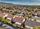 An elevated view showing the streets, landscaping, and varied rooftops in the neighborhood at 7021 Feather Pine St, Las Vegas, NV 89131