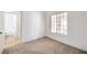 Bedroom with carpet and a large window providing ample natural light at 7021 Feather Pine St, Las Vegas, NV 89131