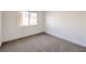 Bedroom with carpet and a window providing natural light at 7021 Feather Pine St, Las Vegas, NV 89131