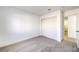 Bedroom featuring neutral carpet, closet, and bright white walls at 7021 Feather Pine St, Las Vegas, NV 89131