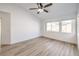 Bright bedroom with a ceiling fan and large windows providing lots of natural light at 7021 Feather Pine St, Las Vegas, NV 89131