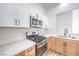 Well-equipped kitchen with modern appliances, sleek countertops, and ample cabinet space at 7021 Feather Pine St, Las Vegas, NV 89131