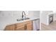 Kitchen featuring stainless dishwasher, white countertops and light wood cabinets at 7021 Feather Pine St, Las Vegas, NV 89131