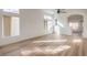 Bright living room featuring modern flooring, a ceiling fan, recessed lighting, and several bright windows at 7021 Feather Pine St, Las Vegas, NV 89131