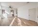 Bright living room featuring modern flooring, a ceiling fan, recessed lighting, and an arched entryway at 7021 Feather Pine St, Las Vegas, NV 89131