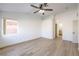 Large main bedroom features ceiling fan, natural light, and an ensuite bath at 7021 Feather Pine St, Las Vegas, NV 89131