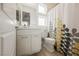 Bright bathroom featuring a shower with a decorative yellow and gray shower curtain at 800 Loch Katrine Ave, Henderson, NV 89012