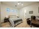 A lovely bedroom with modern decor, light wood flooring, and a light-colored queen bed at 800 Loch Katrine Ave, Henderson, NV 89012