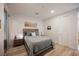 Well-lit bedroom with modern decor, wood-look floors, a comfortable bed, and contemporary lighting at 800 Loch Katrine Ave, Henderson, NV 89012