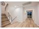 Bright hallway with wood floors, access to outdoor space and second story staircase at 800 Loch Katrine Ave, Henderson, NV 89012