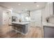 Bright kitchen featuring an island with seating, stainless steel appliances, and ample counter space at 800 Loch Katrine Ave, Henderson, NV 89012