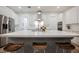 Modern kitchen featuring stainless steel appliances, white cabinets, and an island with seating at 800 Loch Katrine Ave, Henderson, NV 89012