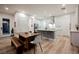 Gourmet kitchen with stainless steel appliances, a dining table, and an island with breakfast bar seating at 800 Loch Katrine Ave, Henderson, NV 89012