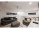 Upstairs living room features hardwood floors, modern furniture, and a wet bar at 800 Loch Katrine Ave, Henderson, NV 89012