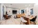 Open concept living space with modern furnishings, hardwood floors, and large windows for natural light at 800 Loch Katrine Ave, Henderson, NV 89012