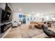 Bright living room with a fireplace, cozy seating, and seamless access to outdoor space at 800 Loch Katrine Ave, Henderson, NV 89012