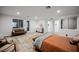 Comfortable main bedroom featuring light wood floors, contemporary furnishings, and lots of natural light at 800 Loch Katrine Ave, Henderson, NV 89012