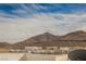 A scenic mountain view with modern homes featuring sleek designs and desert landscaping at 800 Loch Katrine Ave, Henderson, NV 89012