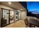 Outdoor patio features sliding glass doors looking into the upstairs living space at 800 Loch Katrine Ave, Henderson, NV 89012