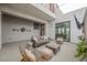 Contemporary patio space with a mounted television, stylish seating, and well-placed decor for relaxation and entertainment at 800 Loch Katrine Ave, Henderson, NV 89012
