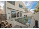 A stunning backyard featuring a sleek pool, and stylish outdoor seating perfect for relaxation and entertaining guests at 800 Loch Katrine Ave, Henderson, NV 89012