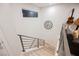 A staircase in a modern home featuring steel railings and modern design at 800 Loch Katrine Ave, Henderson, NV 89012