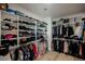 Large walk-in closet with custom shelving and ample hanging space for organized storage at 800 Loch Katrine Ave, Henderson, NV 89012