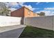 Fenced backyard featuring low-maintenance landscaping with artificial turf at 808 N Torrey Pines Dr, Las Vegas, NV 89107