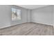 Well-lit bedroom featuring modern flooring, a window and neutral paint at 808 N Torrey Pines Dr, Las Vegas, NV 89107