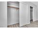 A closet showcasing ample storage with sliding doors and wood-look flooring at 808 N Torrey Pines Dr, Las Vegas, NV 89107