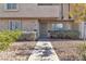 Inviting townhouse entrance with desert landscaping and security doors at 808 N Torrey Pines Dr, Las Vegas, NV 89107