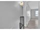 View from staircase landing featuring hallway with hard surface floors and a nearby bedroom at 808 N Torrey Pines Dr, Las Vegas, NV 89107