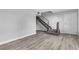 Bright and airy living room featuring modern flooring and staircase access at 808 N Torrey Pines Dr, Las Vegas, NV 89107