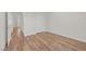 Bedroom featuring wood floors, neutral walls, and a closet for storage at 9304 Cranesbill Ct, Las Vegas, NV 89149