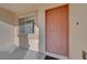 View of the home's entryway, showcasing the front door, sidelight window, and neutral exterior at 9304 Cranesbill Ct, Las Vegas, NV 89149