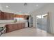 Charming kitchen featuring stainless steel appliances and easy access to the patio at 9304 Cranesbill Ct, Las Vegas, NV 89149