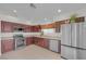 Well-lit kitchen with stainless steel appliances and ample cabinet space at 9304 Cranesbill Ct, Las Vegas, NV 89149