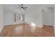 Bright living room featuring hardwood floors and a ceiling fan at 9304 Cranesbill Ct, Las Vegas, NV 89149