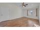 Well-lit living room with ceiling fan and beautiful hardwood floors at 9304 Cranesbill Ct, Las Vegas, NV 89149