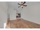 Spacious living room with hardwood floors and a ceiling fan at 9304 Cranesbill Ct, Las Vegas, NV 89149