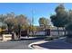 Street view of the Ft Apache Square entrance, showcasing the neighborhood's welcoming curb appeal on a clear day at 9304 Cranesbill Ct, Las Vegas, NV 89149