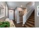 Open entryway leading to a staircase, with a view of the front door and interior details at 937 Spiracle Ave, Henderson, NV 89002