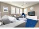 Cozy living room featuring a stylish blue rug, modern furniture, and bright window shutters at 937 Spiracle Ave, Henderson, NV 89002